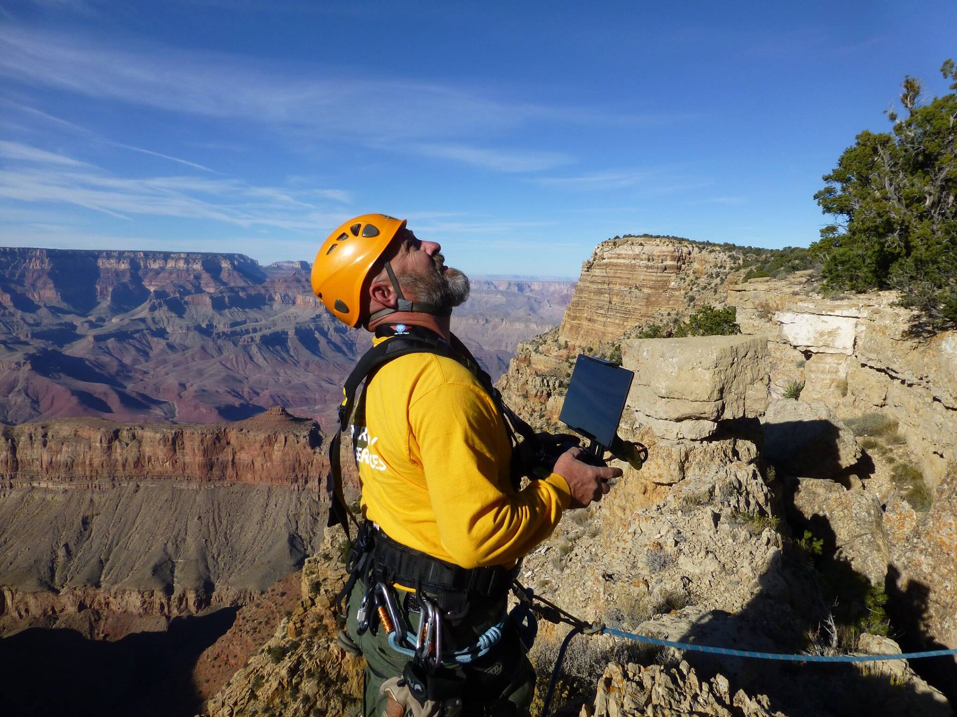 Illustrative photograph of a qualified drone operator working outdoors